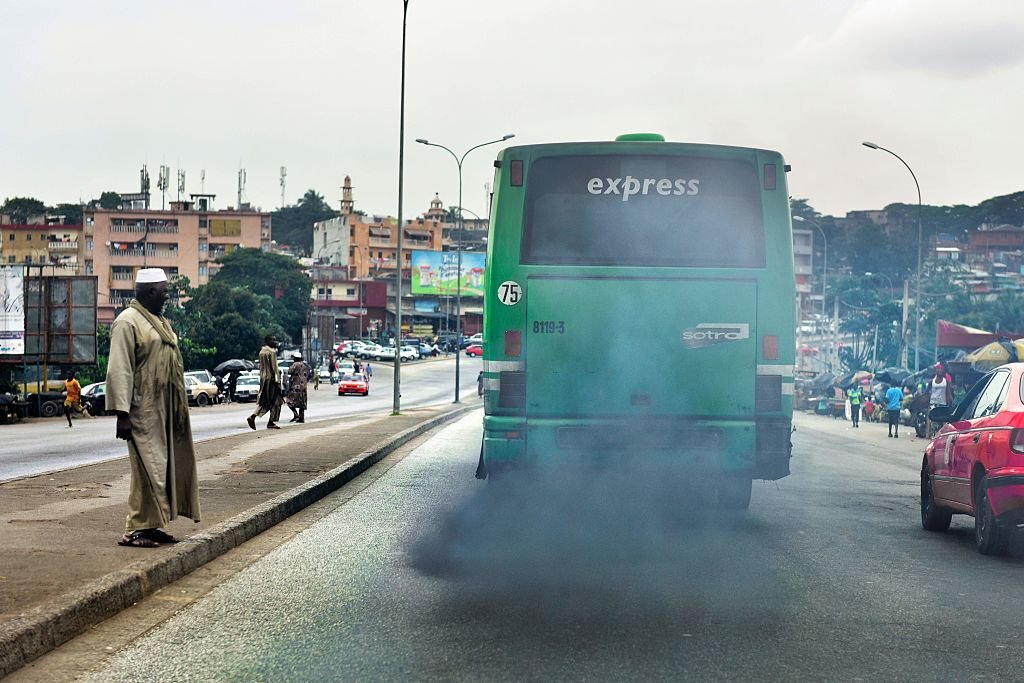 mini bus expelling black smoke from its exhaust in the city of Lagos