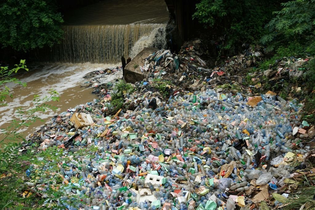 A photo taken on June 2, 2018 shows plastic wastes dumped in water channels at Isolo in Lagos, Nigeria's commercial capital. - The United Nations celebrate on June 5 the World Environmental Day dedicated this year to the theme "Beat Plastic Pollution". (Photo by PIUS UTOMI EKPEI / AFP)        (Photo credit should read PIUS UTOMI EKPEI/AFP via Getty Images)