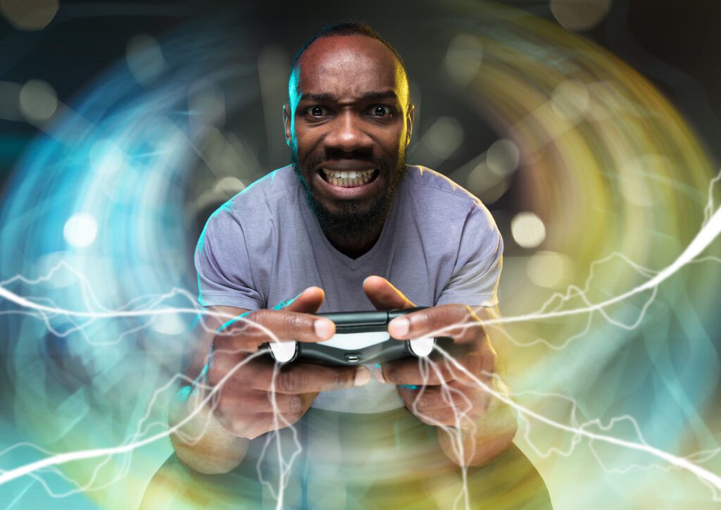 Enthusiastic gamer. Joyful man holding a video game controller